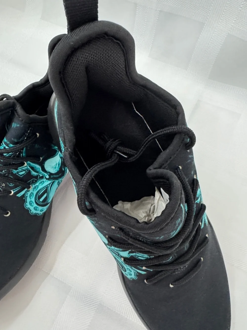 Unisex Black Lightweight Sneakers with Teal Skull Accent